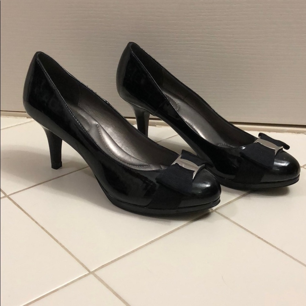 Black heels with silver clasp and bow